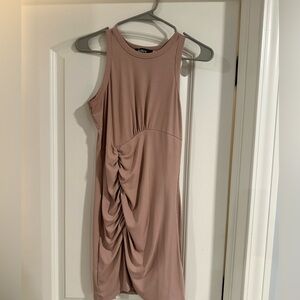 Beige sleeveless ruched mini dress